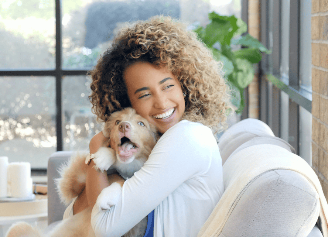 A woman bonds her pup as a way to say to her dog happy Valentine's Day.