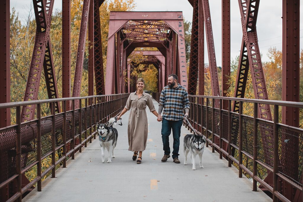 a couple enjoys a affordable date ideas with their dogs