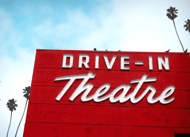 a drive-in theater waits for people to arrive