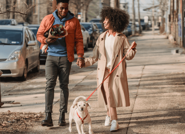 a couple takes a walking tour with their fur kid, get some roses, and enjoy a laugh on their approved dog date