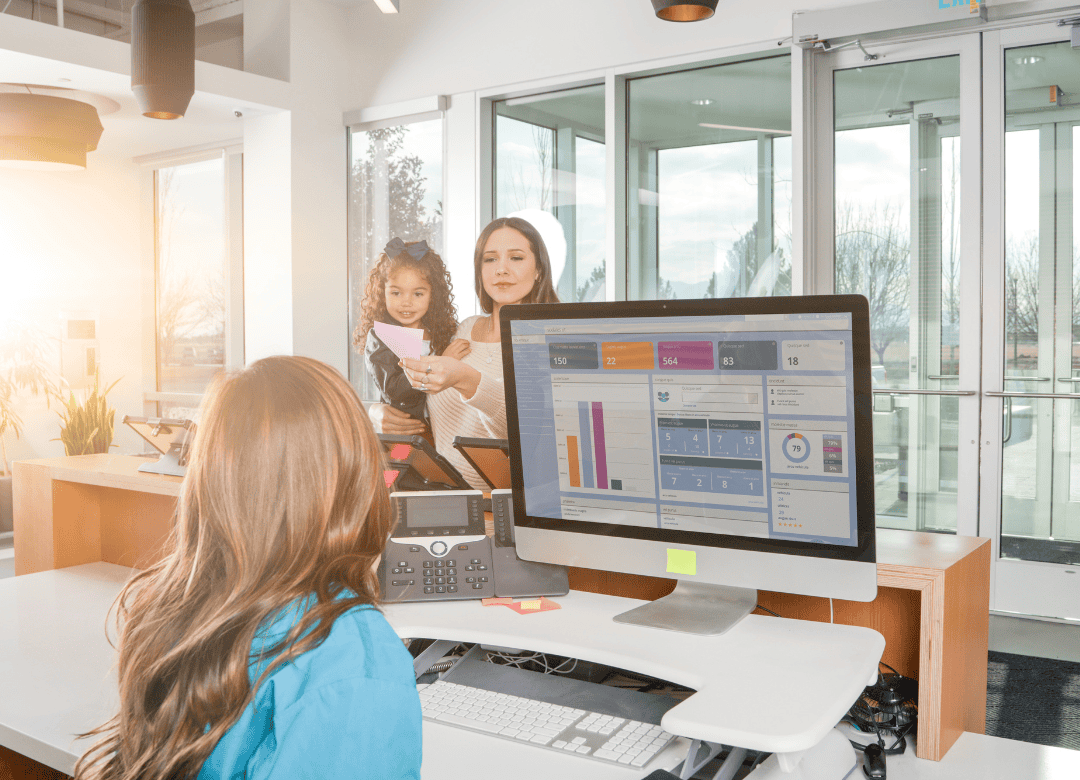 a woman asks questions at her veterinarian clinic