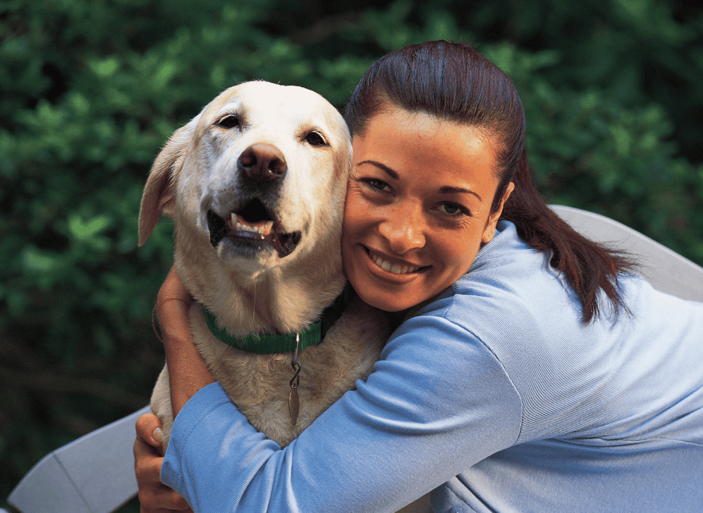 woman hugs her new dog