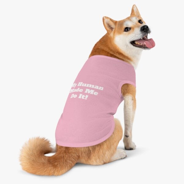 a dog with a pet shirt "my human made me do it" on